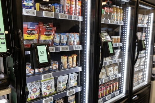 Card reader mounted on a stocked vending cooler