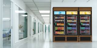 Vending coolers installed along a bright apartment corridor